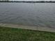 Expansive waterfront with tranquil water, grassy border offering peaceful waterfront living at 122 Pompano Se Dr # A, St Petersburg, FL 33705