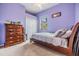 Bedroom with carpet flooring, double closet, a dresser, and neutral color walls at 12508 Balm Riverview Rd, Riverview, FL 33579