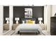 Stylish bedroom with a king-size bed, chic nightstands, and modern decor, blending comfort with contemporary flair at 12621 Aura Moonlight Ter, Parrish, FL 34219