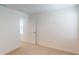 This bedroom features neutral walls, carpet, and a window letting in natural light at 13336 Tropical Breeze Way, Hudson, FL 34669