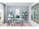 Chic office space boasting a glass desk, shelves, and stylish decor, perfect for productivity at 13336 Tropical Breeze Way, Hudson, FL 34669