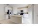 Well-lit kitchen with stainless steel appliances, granite countertops, and white cabinetry at 13354 Tropical Breeze Way, Hudson, FL 34669