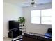 Bright living room with a large window, comfortable seating, and a sleek entertainment center at 14352 Editors Note St, Ruskin, FL 33573