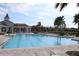 Resort-style community pool featuring an elegant clubhouse and lounge chairs at 14352 Editors Note St, Ruskin, FL 33573