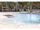 Zero entry community pool with adjacent playground and poolside seating area at 14352 Editors Note St, Ruskin, FL 33573