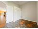 Hallway with white walls, a storage room and uniquely designed tile floors at 15618 Phillips Rd, Odessa, FL 33556