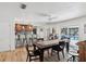 Inviting dining area off the kitchen with views of the pool through sliding glass doors at 15801 Bridgewater Ln, Tampa, FL 33624