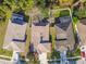 Aerial view of the property showing the house, roof, driveway, backyard, and proximity to neighborhood homes at 15807 Leatherleaf Ln, Land O Lakes, FL 34638