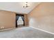 Carpeted bedroom with natural light from the window, offering a calm and comfortable space at 15807 Leatherleaf Ln, Land O Lakes, FL 34638