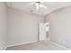 This bedroom has neutral paint, a ceiling fan, and carpeted flooring at 15807 Leatherleaf Ln, Land O Lakes, FL 34638