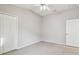 Neutral toned bedroom with closet and private entry to ensuite bathroom at 15807 Leatherleaf Ln, Land O Lakes, FL 34638