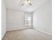 Bedroom featuring neutral walls, plush carpeting, and a single window at 15807 Leatherleaf Ln, Land O Lakes, FL 34638