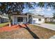 Lovely single-story home showcasing a manicured lawn, a bright exterior paint job, and an attached two-car garage at 15807 Leatherleaf Ln, Land O Lakes, FL 34638