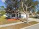 Charming single-Gathering home featuring a well-maintained lawn, a two-car garage, and a welcoming front porch at 15807 Leatherleaf Ln, Land O Lakes, FL 34638