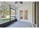 The screened in lanai provides a relaxing outdoor space with views of the backyard at 15807 Leatherleaf Ln, Land O Lakes, FL 34638