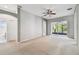 Large main bedroom with a ceiling fan, carpet flooring, and sliding doors to the lanai at 15807 Leatherleaf Ln, Land O Lakes, FL 34638