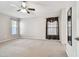 Spacious main bedroom with neutral tones and a large window, offering comfort and style at 15807 Leatherleaf Ln, Land O Lakes, FL 34638