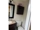 Classic bathroom with a granite countertop, mirror, and toilet at 16240 Lake Palm Dr, Lutz, FL 33549