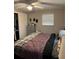 Bedroom with a comfortable bed, closet, and dresser at 16240 Lake Palm Dr, Lutz, FL 33549