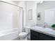 Cozy bathroom with shower-tub combo, toilet, and vanity with granite countertop at 17749 Garsalaso Cir, Brooksville, FL 34604