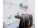 Laundry room featuring modern black Samsung washer and dryer, and white utility sink at 17749 Garsalaso Cir, Brooksville, FL 34604