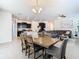 Open-concept layout combining dining, kitchen, and living areas with stylish finishes and plenty of space at 17749 Garsalaso Cir, Brooksville, FL 34604