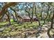 Charming home with a long drive and mature oak trees, providing a tranquil and private setting at 2690 E Lake Trl, Tarpon Springs, FL 34688
