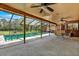 Relaxing screened-in pool with an outdoor kitchen area and plenty of space for entertaining at 2690 E Lake Trl, Tarpon Springs, FL 34688