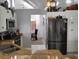 Kitchen view leading to the dining room, featuring stainless steel appliances at 28 Sportsman Pl, Rotonda West, FL 33947