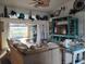 Cozy living room with vaulted ceilings, stylish decor, and sliding doors to the patio at 28 Sportsman Pl, Rotonda West, FL 33947