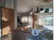 Open-concept living area with decorative wooden wall and a view of the dining area at 28 Sportsman Pl, Rotonda West, FL 33947