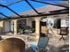 A cozy patio with lounge chairs sits adjacent to the refreshing pool at 28 Sportsman Pl, Rotonda West, FL 33947