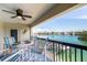 Relax on your balcony, overlooking the scenic waterways with dining set and ceiling fan at 3111 Pass A Grille Way # 213, St Pete Beach, FL 33706
