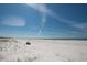 Peaceful beach scene with a bench overlooking the ocean at 3111 Pass A Grille Way # 213, St Pete Beach, FL 33706