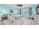 Cozy bedroom with a queen bed, coastal decor, a ceiling fan, and views of the outside at 3111 Pass A Grille Way # 213, St Pete Beach, FL 33706