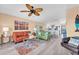 A bright living room features comfortable seating, stylish decor, and an open layout to the kitchen at 3111 Pass A Grille Way # 213, St Pete Beach, FL 33706