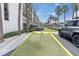 Assigned parking spot near the building with easy access and a well-maintained surrounding area at 3111 Pass A Grille Way # 213, St Pete Beach, FL 33706