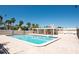Enjoy the outdoors in the community swimming pool with a large deck area, perfect for relaxation and recreation at 3111 Pass A Grille Way # 213, St Pete Beach, FL 33706