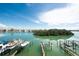 Stunning water view with boats and boat lifts, showcasing waterfront living and recreational opportunities at 3111 Pass A Grille Way # 213, St Pete Beach, FL 33706