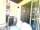 Relaxing porch with comfortable furniture and a sliding door, perfect for outdoor living at 3128 Bayshore Oaks Dr, Tampa, FL 33611