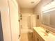 Cozy bathroom featuring a tub with shower and a vanity with cream countertops at 3128 Bayshore Oaks Dr, Tampa, FL 33611