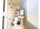 Stylish half bath with pedestal sink, decorative mirror, and art creating a charming space at 3128 Bayshore Oaks Dr, Tampa, FL 33611