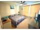 Comfortable bedroom with ceiling fan, neutral walls, and cozy carpet for a relaxing retreat at 3128 Bayshore Oaks Dr, Tampa, FL 33611