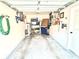 A spacious one-car garage featuring storage and a side entry door at 3128 Bayshore Oaks Dr, Tampa, FL 33611