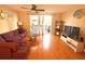 Bright and inviting living room with hardwood floors and sliding doors to outdoor deck at 3128 Bayshore Oaks Dr, Tampa, FL 33611