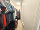 Spacious walk-in closet offering ample storage with organized clothing racks and shelving at 3128 Bayshore Oaks Dr, Tampa, FL 33611