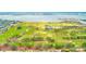 Panoramic aerial of waterfront golf course with city skyline in the background at 316 Barbara Cir, Belleair, FL 33756