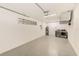 Spacious basement with a utility sink, water heater, and washer and dryer at 316 Barbara Cir, Belleair, FL 33756