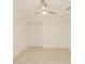 Bedroom featuring a ceiling fan, white walls, and wood-look flooring at 316 Barbara Cir, Belleair, FL 33756