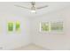 Bright bedroom with white plantation shutters at 316 Barbara Cir, Belleair, FL 33756